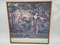 Full view of framed art print including frame and bottom attribution