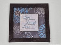 Full view of the framed artwork showing design and frame