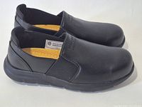 Side view of both shoes showing uppers and general condition