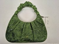 Front view of green JW PEI handbag