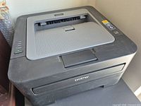 Top and front view of Brother HL-2240 printer