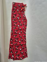 Full length view of red reindeer print pajama pants