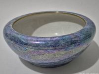 Angled view showing overall bowl shape and iridescent glaze