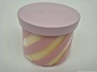 Closed candle showing full exterior swirl design and lid