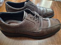 Left and right shoes side view showing uppers, laces and stitching