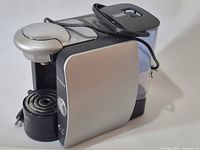 Full view of Bosch Tassimo coffee maker showing water reservoir and drip tray