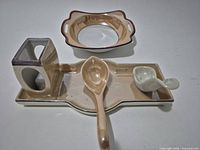 Top view of all five beige porcelain serving pieces