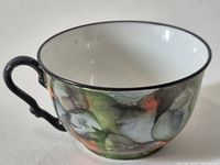 Full side view showing handle, rim and interior