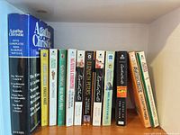 Shelf view of Agatha Christie paperbacks including omnibus and assorted single novels