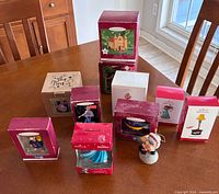 Group shot showing all boxed and loose ornaments on table