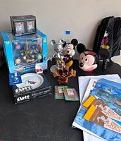 Group shot of boxed figurine set, loose figurines, plate, container, trading cards and paperwork