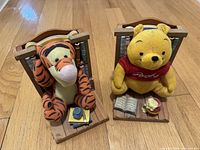 Winnie the Pooh and Tigger plush bookends on wood-look bases