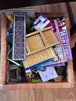 Mixed bricks, plates, instruction sheets in basket