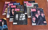 Stack of five 1960s LIFE magazines with visible Beatles, Cleopatra, eclipse, Hemingway and Namath covers