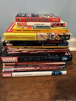 Full stack of 16 Marvel graphic novels and hardcovers