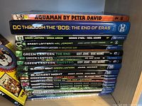 Stack of Green Lantern, Aquaman and DC anthology books