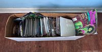 Top view of long box filled with upright comic books