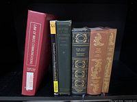 All six books standing to show spines and titles
