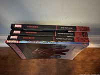 Four Daredevil paperbacks stacked spine-up