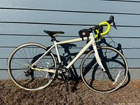 Full left side view of Schwinn road bike showing frame, wheels, drivetrain, brakes, handlebar bag