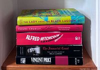 Stack of five horror film figure biography books showing spines