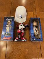 Two Billie Jean King bobblehead boxes, Mickey Mouse figurine, Brooklyn Dodgers mini helmet