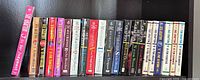 Row of 21 Sue Grafton Alphabet series paperback novels showing spines and titles