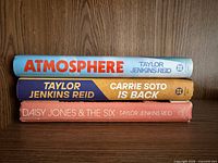 Spines of all three hardcover books showing titles and author