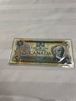 Full view of the 1972 Canadian $5 bill in sleeve