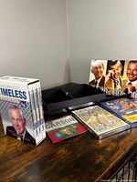 Group shot of all DVDs, sleeve and storage box