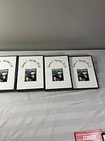 Front view of four DVD cases labeled Season 1-4