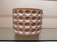 planter front view showing pattern and feet