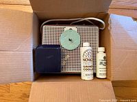 Grinder unit, spare bit box, two coolant bottles inside shipping box