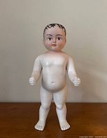 Front view of 12" bisque Frozen Charlie boy doll standing upright