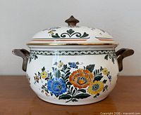 Front view of Asta enamel Dutch oven with lid and floral design