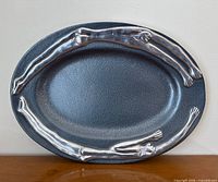Full view of oval Carrol Boyes Conversation serving plate