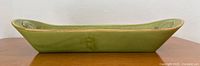 Side profile of green ceramic tray