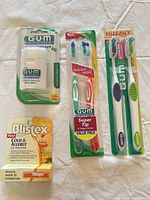 Overview of all packaged items: GUM floss, Super Tip toothbrush value pack, classic toothbrush value pack, Blistex lip balm