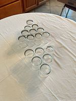 All 15 clear glass jars arranged in triangle formation