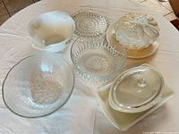 Group view of all nine pieces including milk glass and clear glass items