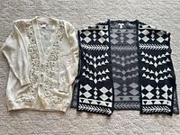 Both cardigans laid flat front view