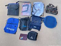 Group shot of all 10 assorted bags laid out on ground