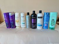 Front view of all ten bottles lined in a row