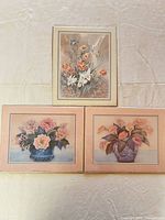 All three floral lithograph prints grouped together