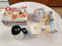 Group shot of all five items: juicer, immersion blender, Quick Minute box, two coffee carafes