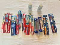All toothbrushes and both baby powders laid out