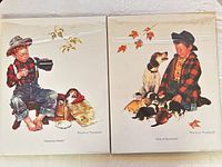 Both poster prints side by side in plastic