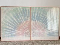 Both framed prints side by side showing full artwork and titles