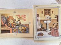 Both board-mounted prints side by side