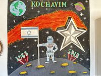 Full view of entire painting with astronaut, flag, comet, star and text